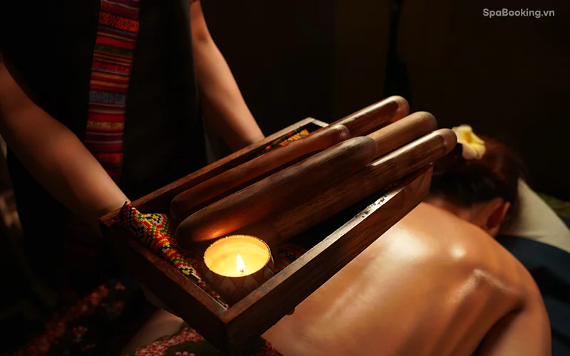 Therapists using bamboo techniques for deep relaxation
